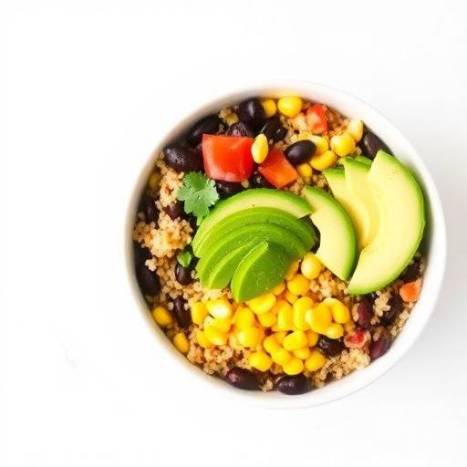 A colorful bowl filled with quinoa, black beans, corn, and avocado, representing plant-based proteins.